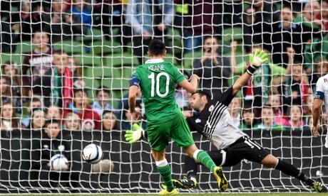 Robbie Keane hits the net with his penalty.