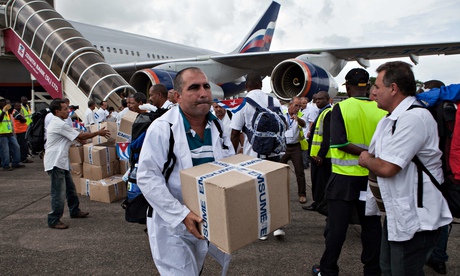 Cuban doctors and health workers arrive at Freetown's airport to help the fight against Ebola in Sie