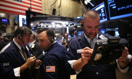 Traders work on the floor of the New York Stock Exchange (NYSE) on October 10, 2014 in New York City.