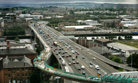 The M8 motorway's Kingston bridge crosses the Clyde and slices its way through Glasgow city centre soon to controversialy connect with the M74