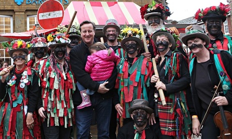 david cameron poses with blackface dancers