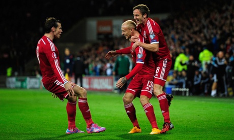 David Cotterill celebrates his opening goal with Gareth Bale and Andy King.