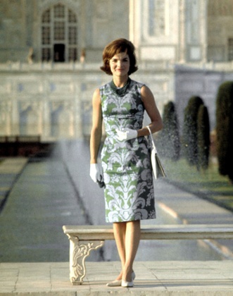 First Lady Jackie Kennedy standing on the grounds of the Taj Mahal.