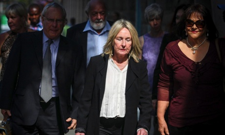 June Steenkamp (front centre), and Barry Steenkamp (back, centre), parents of Reeva Steenkamp, arrive at the high court on Tuesday.