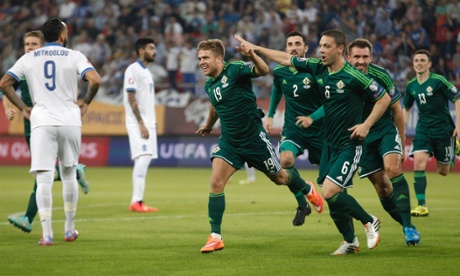 Jamie Ward (19) and Chris Baird lead the celebrations.