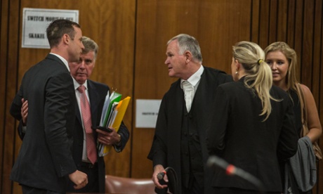 Oscar Pistorius (left) with his legal team, including Brian Webber (second from left) and leading counsel Barry Roux (centre).