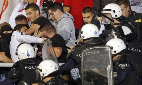 Riot police clash with fans during Serbia's Euro 2016 qualifier against Albania.