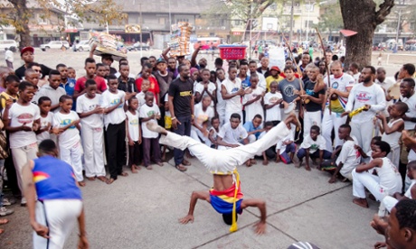 Dancers perform in the streets of contemporary Kinshasa.