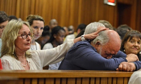 Barry Steenkamp, the father of Reeva Steenkamp, flanked by his wife June, in court on Wednesday.
