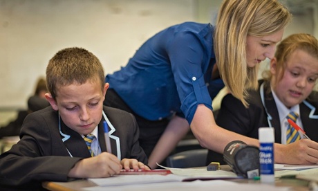 A teacher helps students at the Clacton Coaastal Academy.