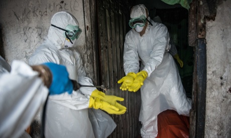 Red Cross members workers each other before in Monrovia, Liberia. ebola