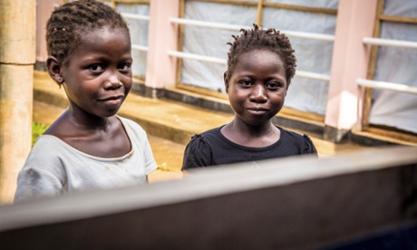 Two children recovering from Ebola virus wait at a treatment centre in the Hastings area of Freetown, Sierra Leone.