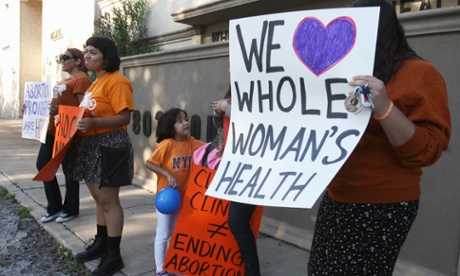 People protest in front of the Whole Women's Health clinic Saturday, 4 October in McAllen, Texas. 