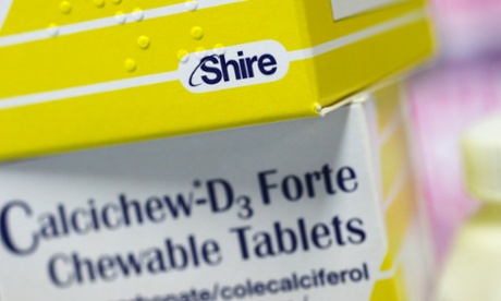 Vitamins made by Shire are displayed at a chemist's in northwest London.