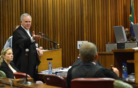 Barry Roux, lawyer of South African athlete Oscar Pistorius, speaks while pointing to prosecutor Gerrie Nel during Pistorius' sentencing proceedings.