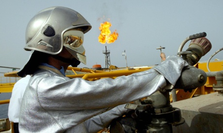 An Iranian technician works at the Balal offshore oil platform.