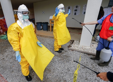 Students wearing personal protective equipment participate in a Centers for Disease Control and Prevention (CDC) training session