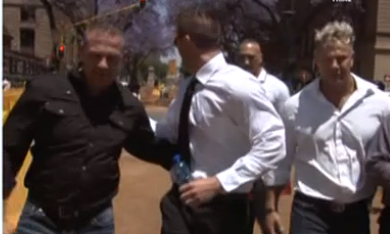 The three men outside the Pretoria high court.