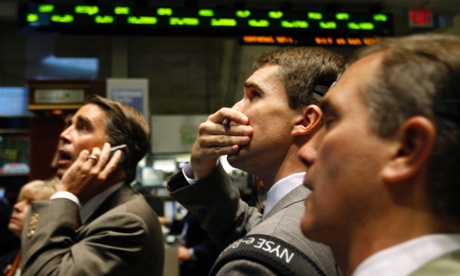 Traders watch stock prices fall on the trading floor of the New York Stock Exchange in October 2008.