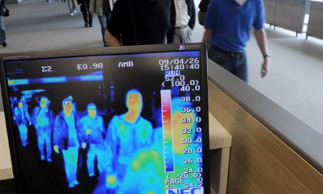 A thermal camera system monitors the body heat of passengers arriving from abroad to check for possible infections.