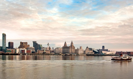 Ferry crossing the River Mersey in front of the Liverpool city skyline