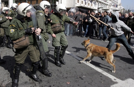 A file photo dated 24 February 2010 shows Loukanikos barking at riot policemen during clashes that broke out in Athens during a general strike against austerity measures.