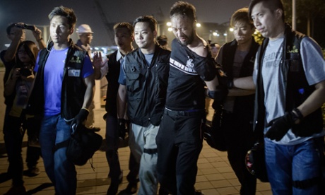 Civic Party member Ken Tsang, one of Hong Kong's pro-democracy political groups, is taken away by policemen, before being allegedly beaten up by police forces.