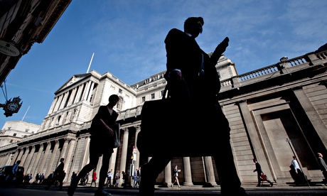 Pedestrians pass the Bank of England