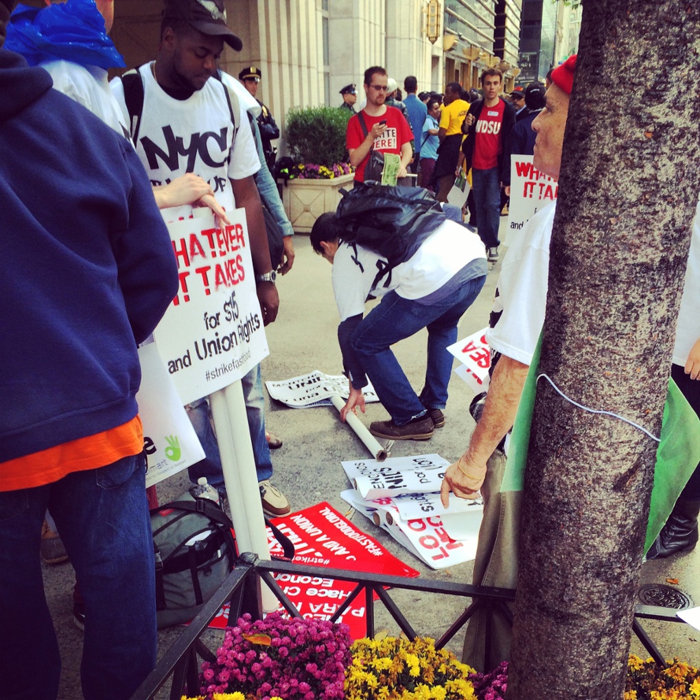 US Money Walmart protest signs 