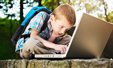 Boy focused on notebook