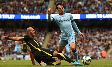 David Silva goes to ground, brought down by Younes Kaboul.