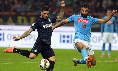Internazionale's Mauro Icardi, left, fires in a shot as  Raúl Albiol desperately attempts to make the block.
