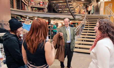 Richard A. Hayne, founder and chairman of Urban Outfitters jokes with employees inside a store in Philadelphia in 2006