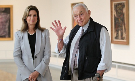 Retail mogul Leslie Wexner, right, and his wife Abigail tour the Transfigurations exhibit at the Wexner Center for the Arts Friday, Sept. 19, 2014