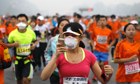 A runner wearing a mask during the Beijing International Marathon.