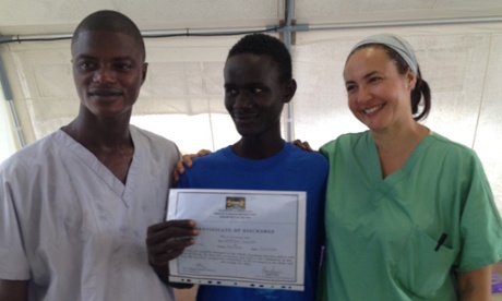 An Ebola survivor with a certificate of discharge