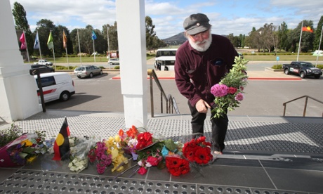 Bruce White 59 adds some flowers to a growing memorial on the steps of Old Parliament House in Canberra this afternoon, Bruce was able to vote for the first time in the 1974 double dissolution election because Prime Minister Gough Whitlam lowered the voting age to 18. Tuesday 21st October 2014.