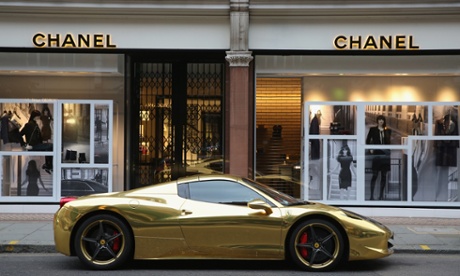 A Gold Ferrari sits outside Chanel on Sloane Street in London.