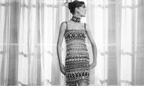 Old photo of model in African-style sleeveless dress looking right