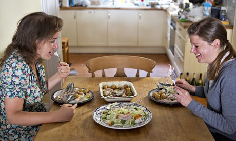 Felicity Cloake (right) shares her baked mackerel and potatoes with Hadley Freeman. Photograph: Grah