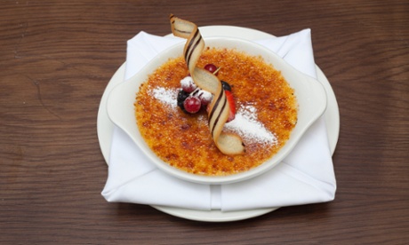 The crème brûlée with a curly biscuit on top at Brasserie Gustave.
