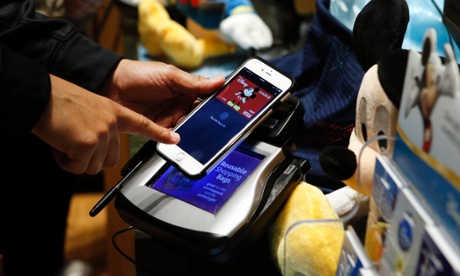 Apple Pay in use at a Disney Store. The US company's results failed to lift key chip supplier Arm. Photo: Jason DeCrow/Invision for Disney/AP Images
