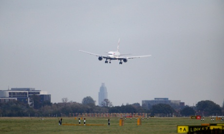 A plane comes into land in the strong winds at Heathrow airport 