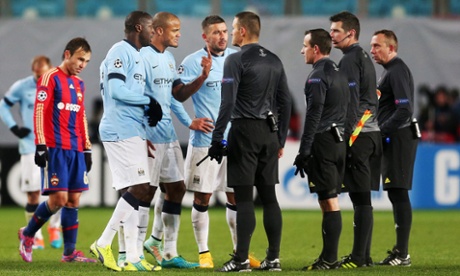 Manchester City's Vincent Kompany, centre, Yaya Toure, left, and Aleksandar Kolarov remonstrate with referee Istvan Vad at the end of the match