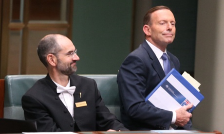 The Prime Minister Tony Abbott sits down to listen to the speaker on his way out of question time this afternoon in the House of Representatives chamber of Parliament House, Canberra, Wednesday 22nd October 2014