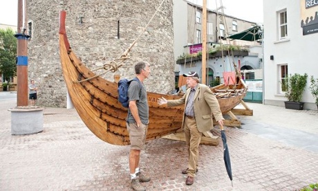 Tony Hawks in front of a Viking longboat