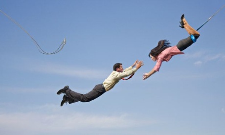Business people on flying trapeze