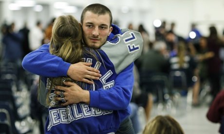 Sayreville football team students arrive at a board of education meeting to discuss the continuity of the team coaches.