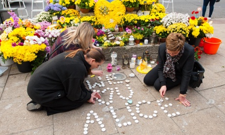 Mourners light candles in memory of Alice Gross.