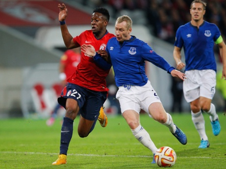 Tony Hibbert keeps the ball away from Divock Origi.